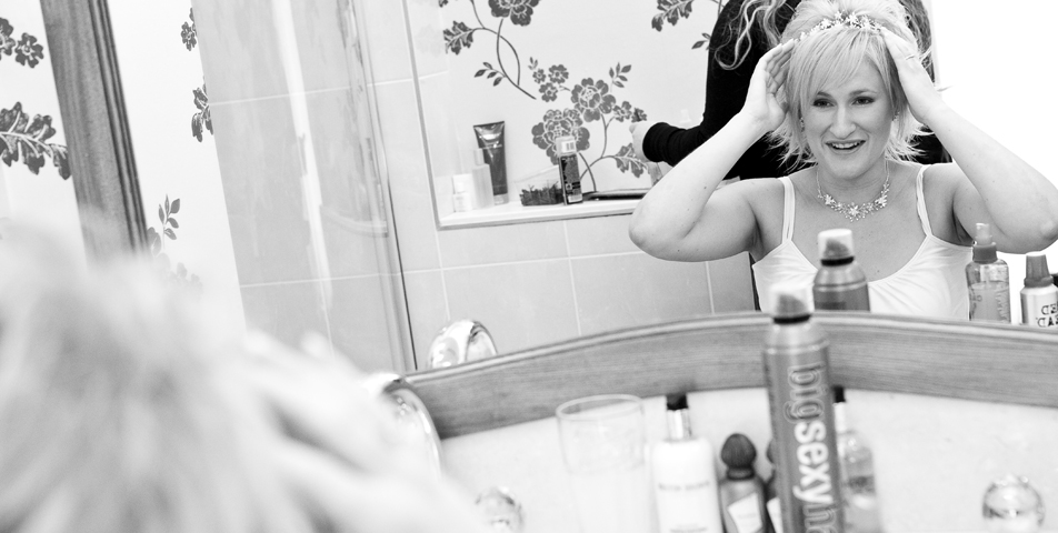 "Photography of adding the finishing make up for the brides wedding in Derbyshire"
