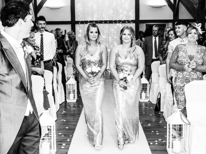 photography-of-the-bridesmaids-at-the-wedding-ceremony-at-Sandhole-Oak-Barn-Congleton-Cheshire