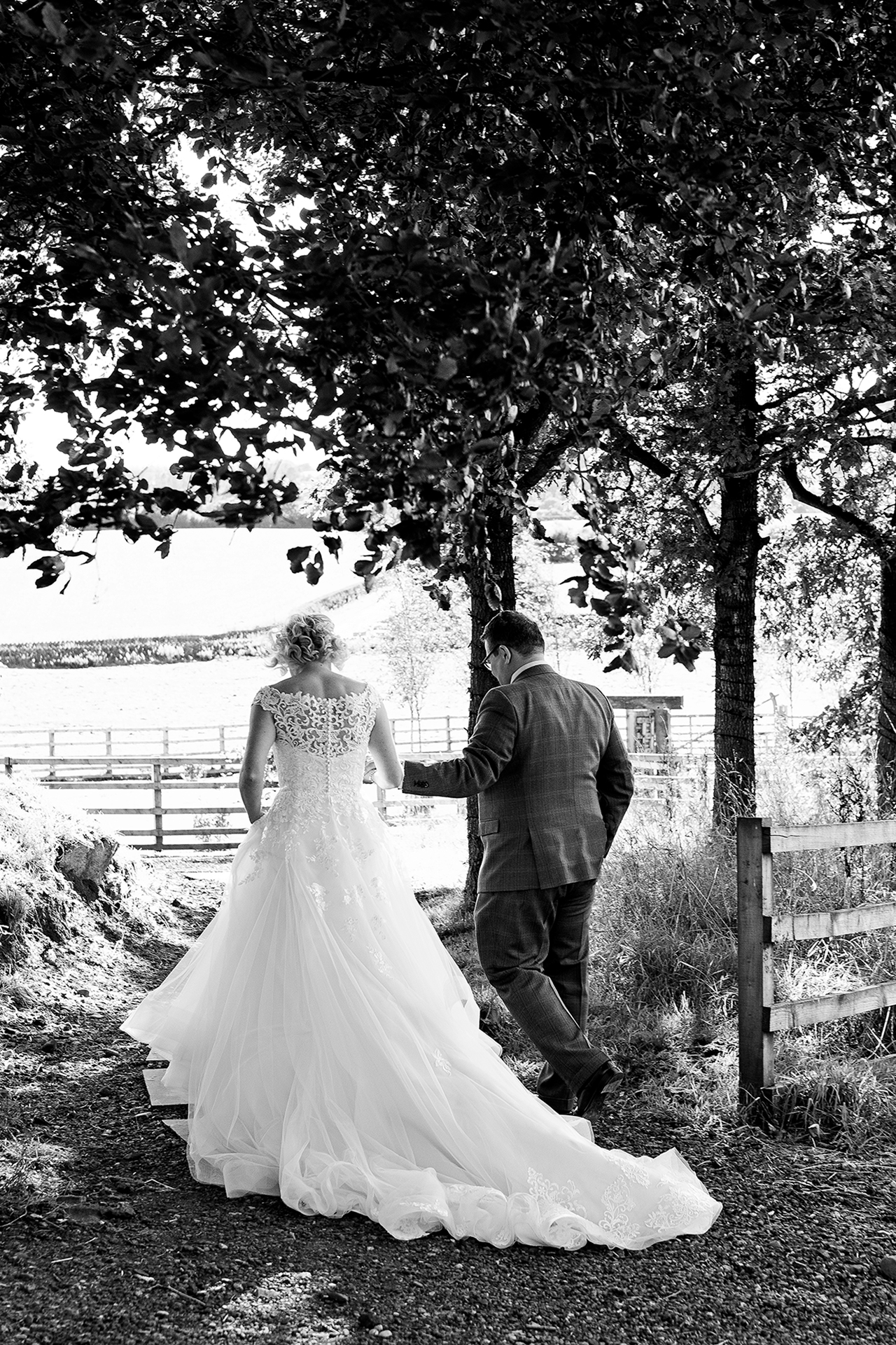 the bride and groom in the grounds of bash hall barn wedding venue
