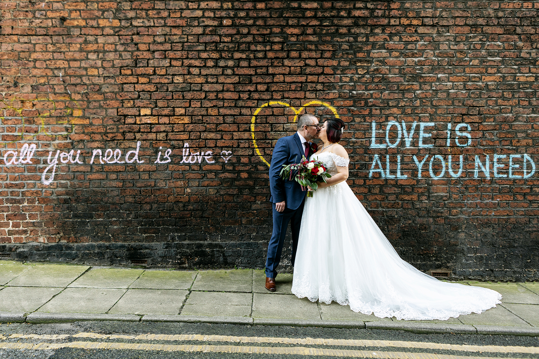 wedding photography of the bride and groom in liverpool just outside the hope street hotel