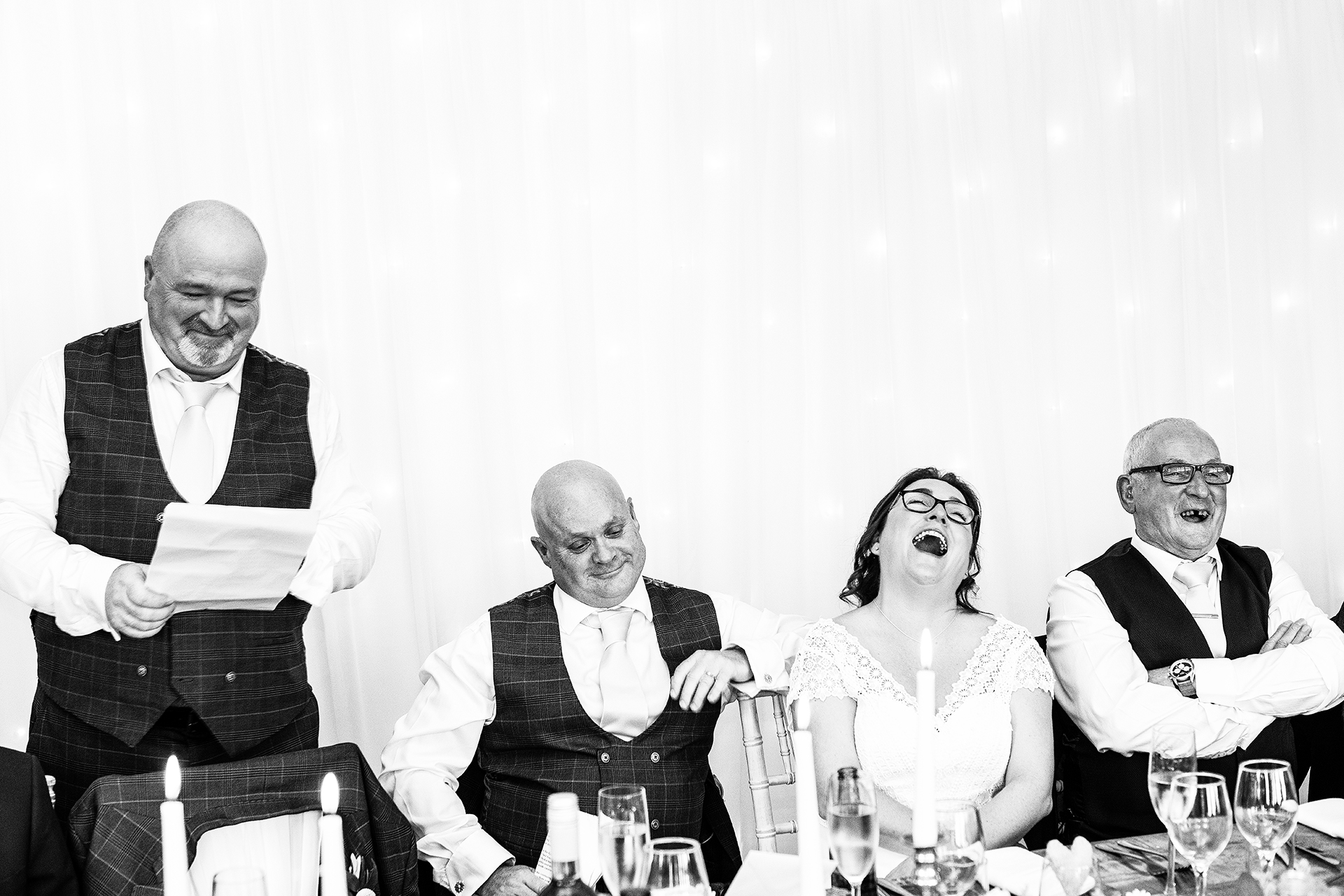 natural wedding photography of the best man delivering his wedding speech