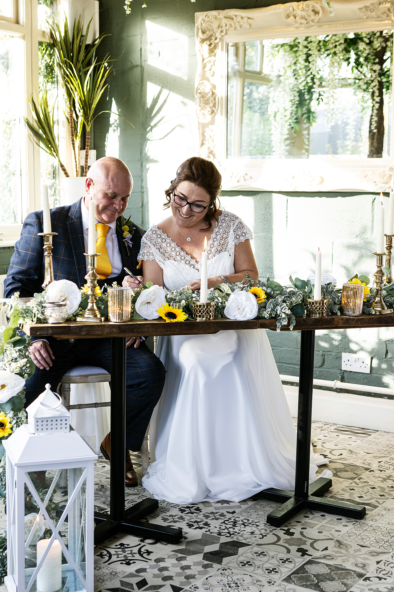 photography of the signing of the register after the wedding ceremony
