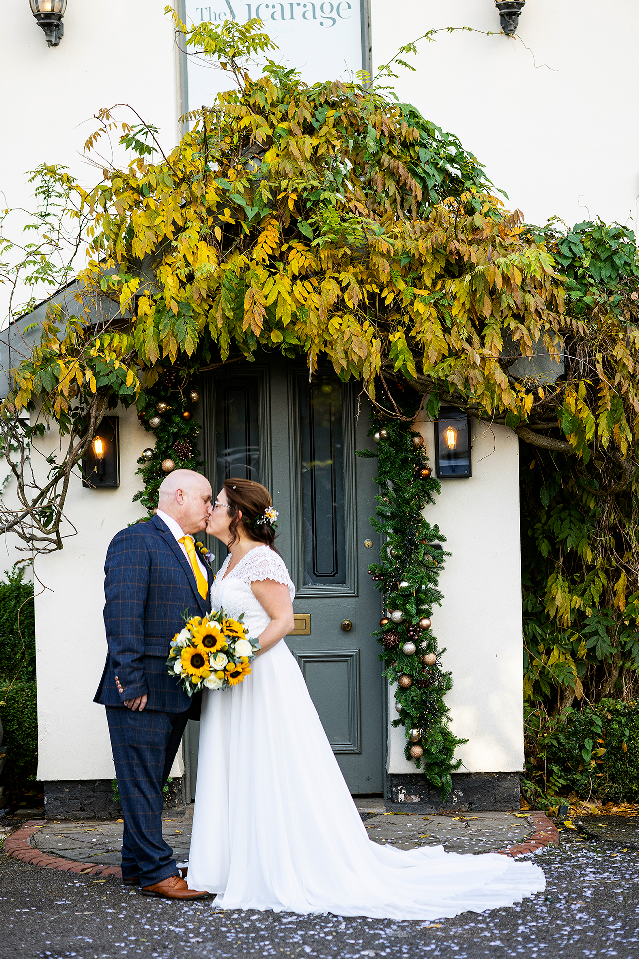 the bride and groom photographed outside the vicarage hotel cheshire