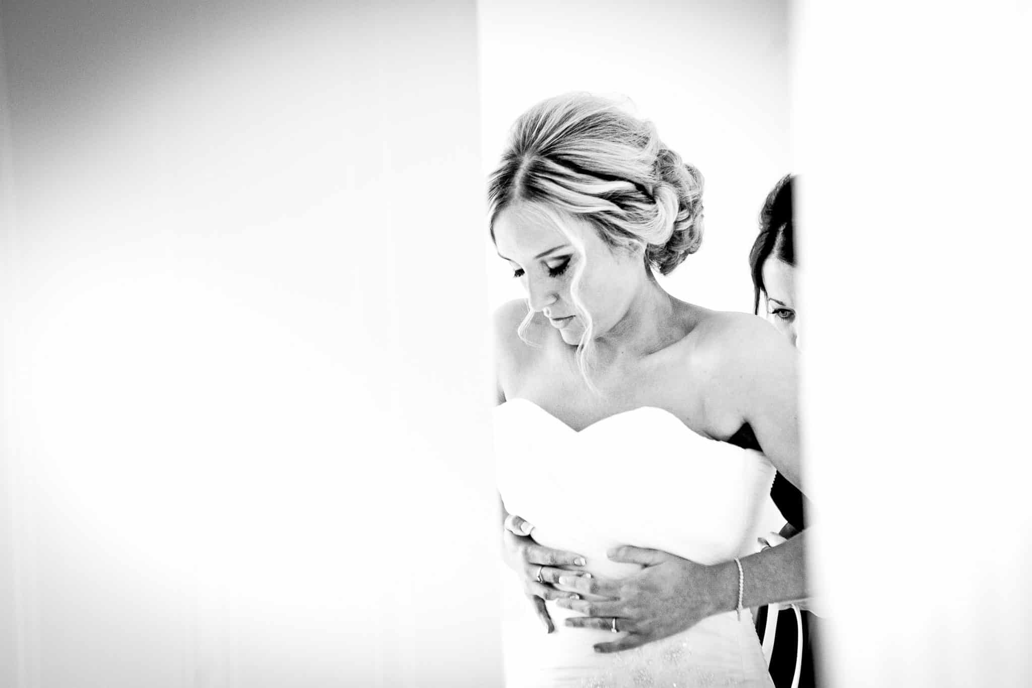 black and white wedding photography of the bride getting ready in Macclesfield Cheshire