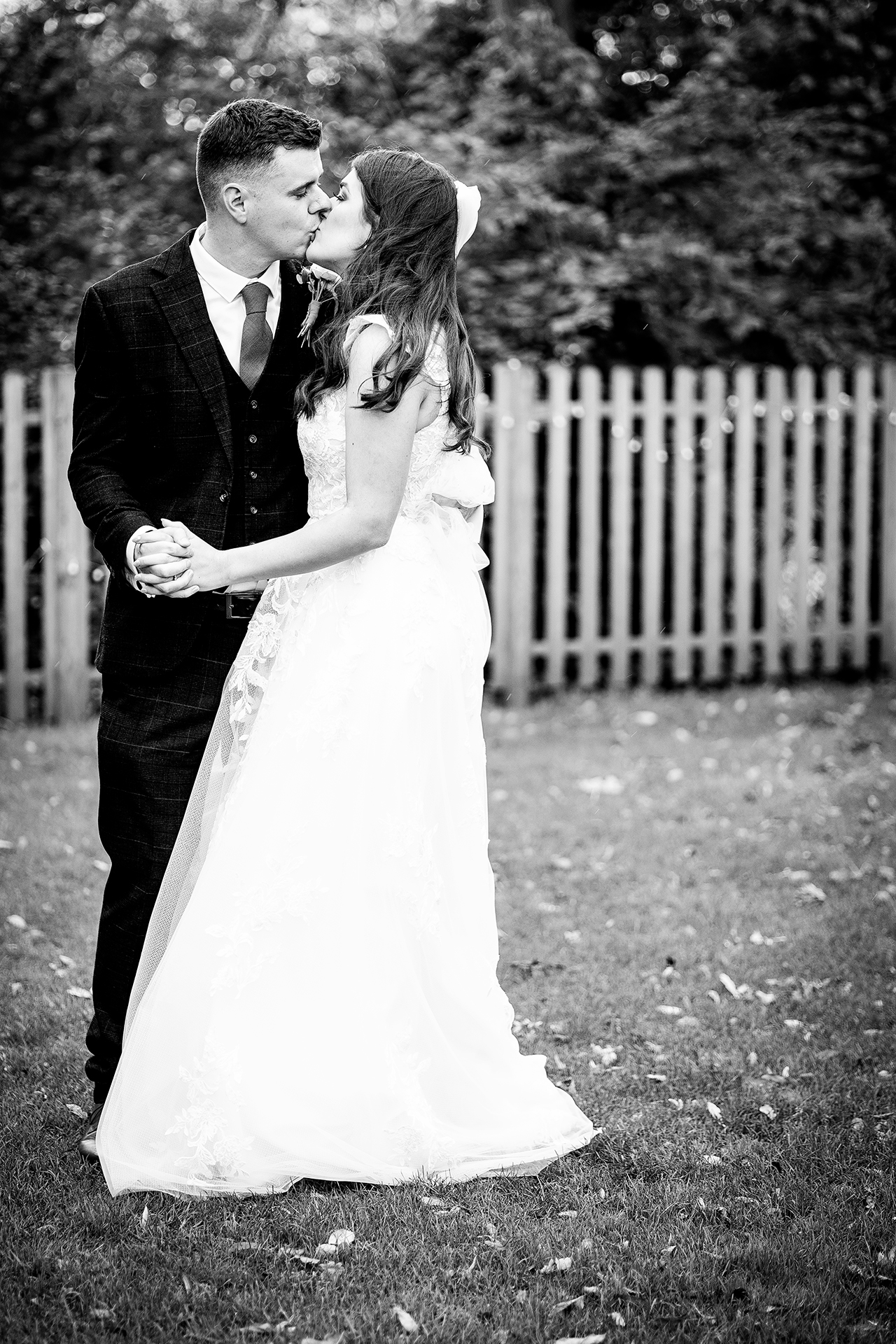 the bride and groom on the grounds of the little fox wirral